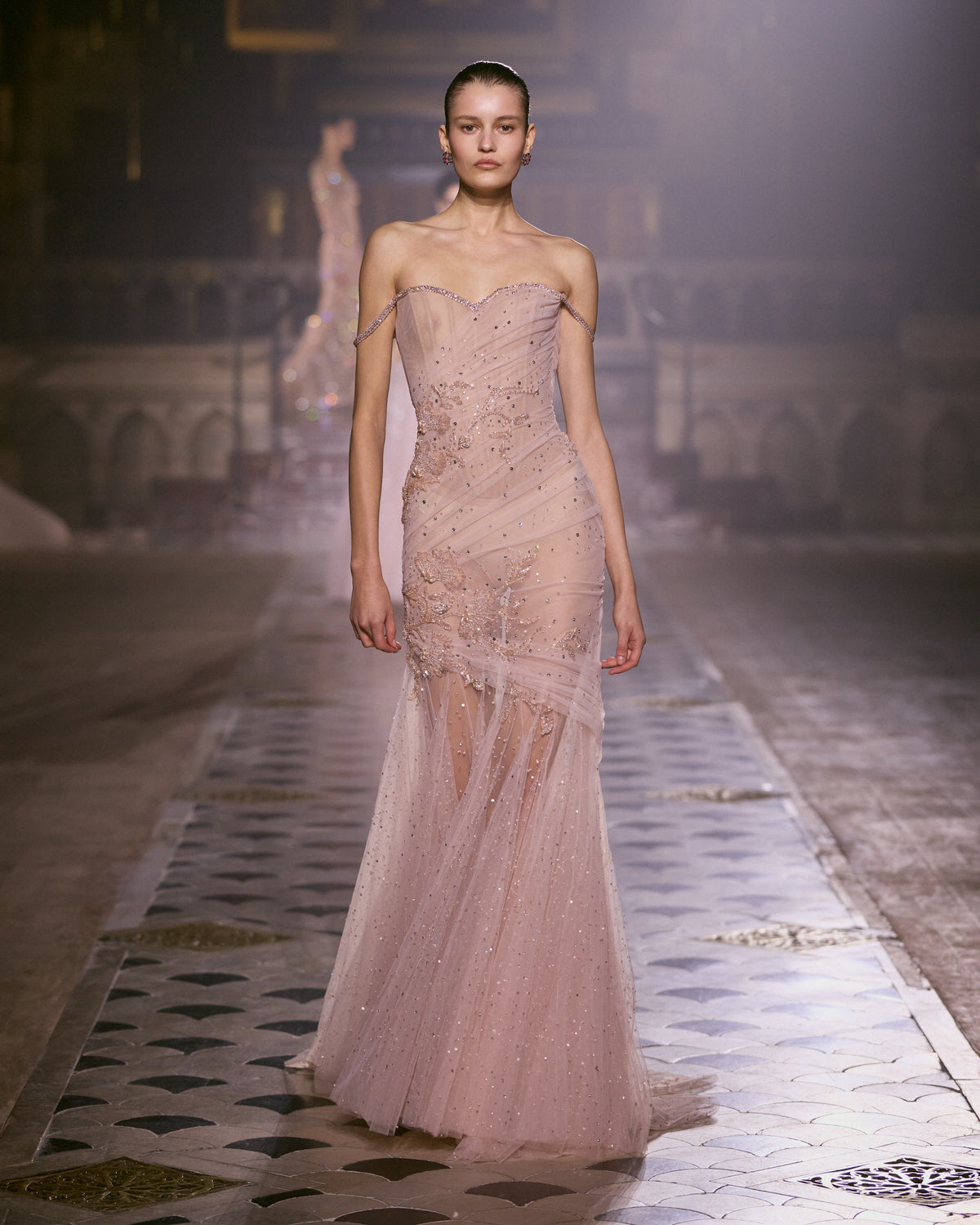 Blush pink couture gown with draped bodice, delicate crystal embellishments and flowing sheer tulle skirt.