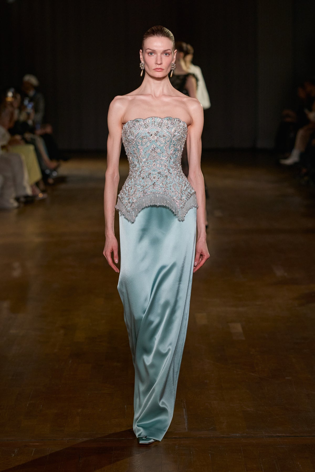 Light blue strapless gown with crystal-embellished structured bodice and fluid floor-length satin skirt.