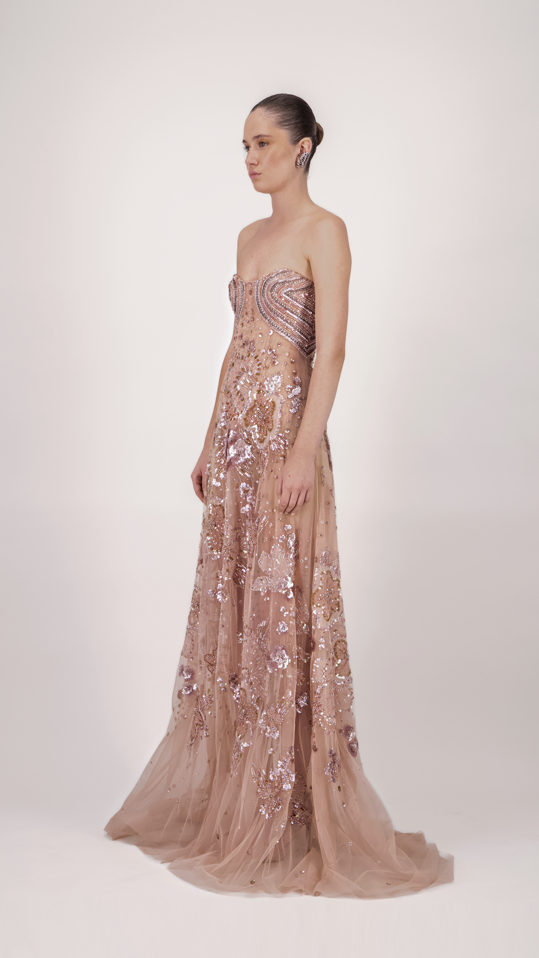 Woman wearing a strapless, sequined evening gown