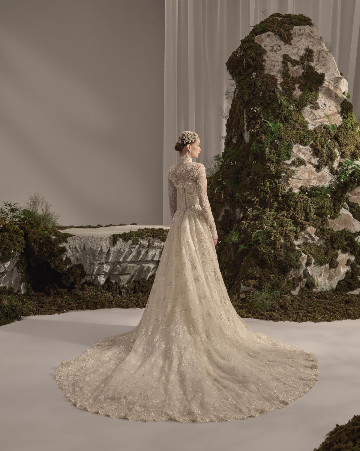 Embellished bridal gown with a structured corset bodice, flowing skirt and detachable long-sleeve embroidered bolero.