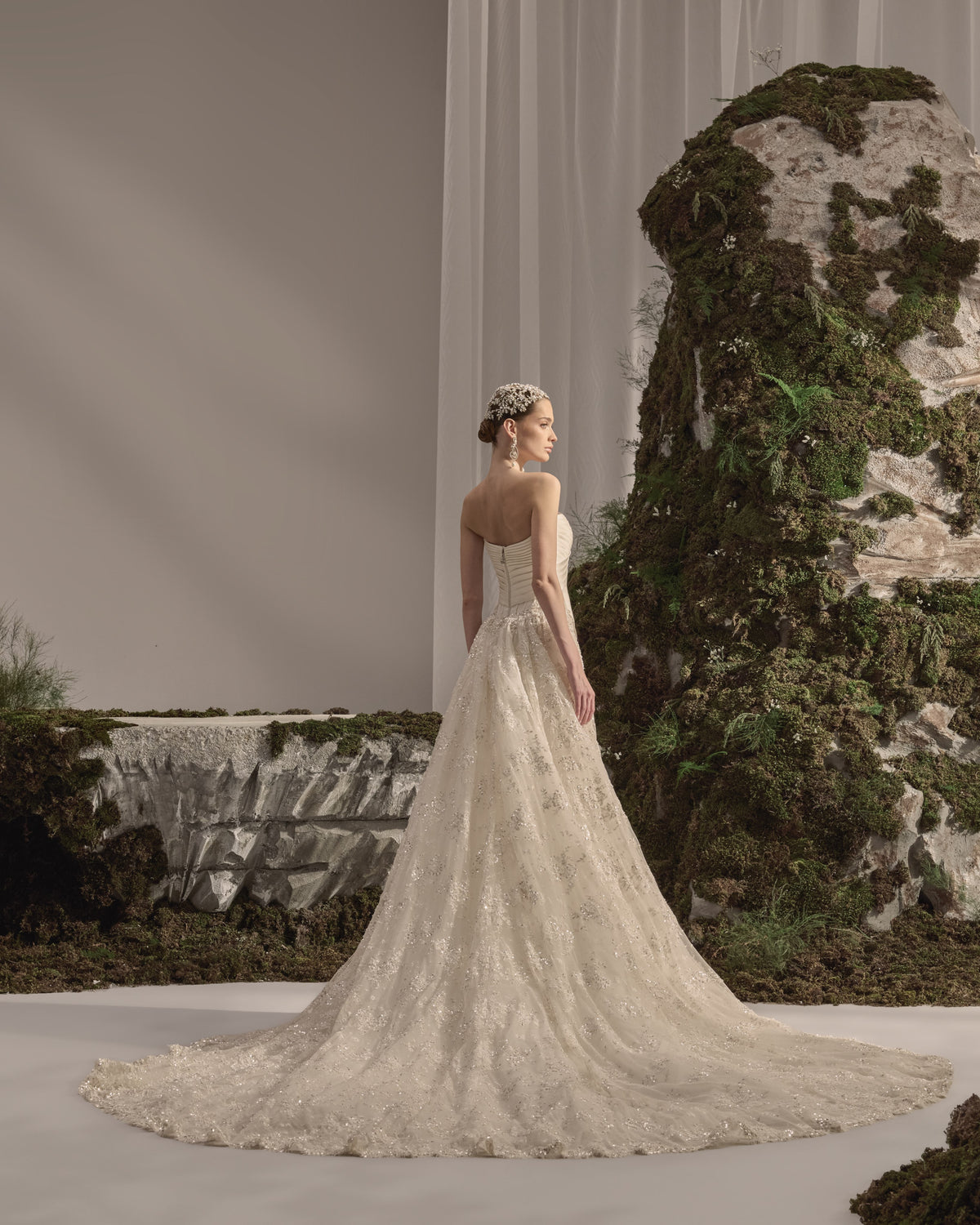 Embellished bridal gown with a structured corset bodice, flowing skirt and detachable long-sleeve embroidered bolero.