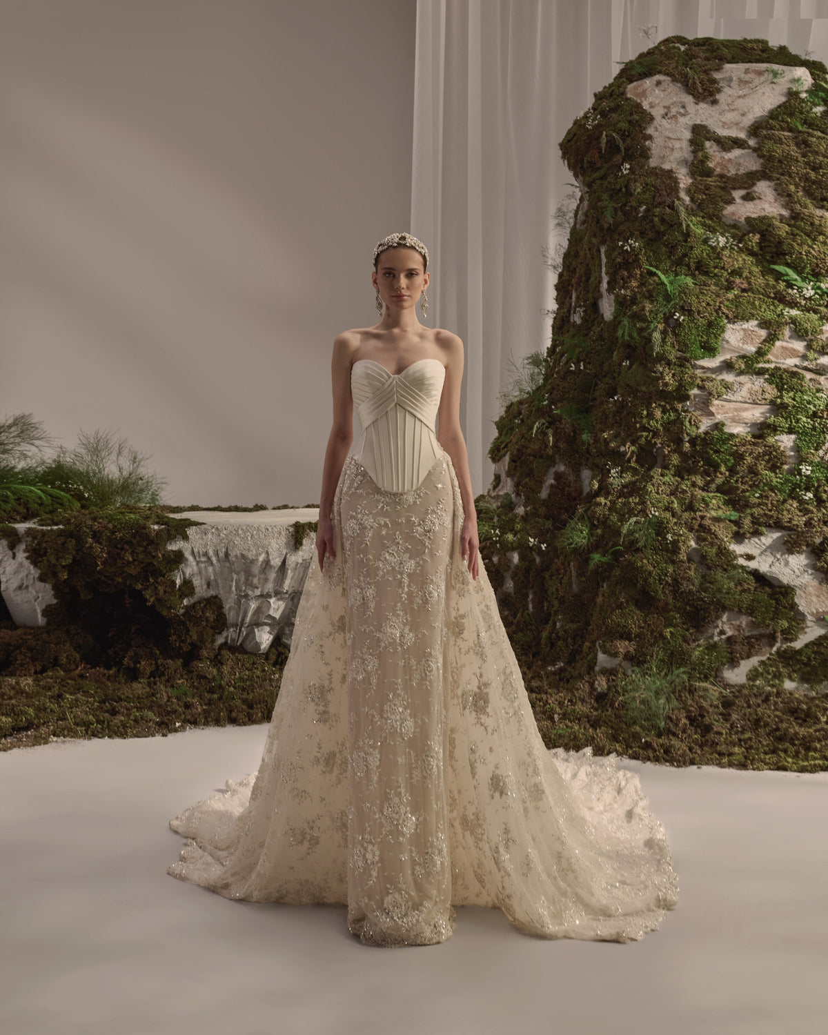 Embellished bridal gown with a structured corset bodice, flowing skirt and detachable long-sleeve embroidered bolero.