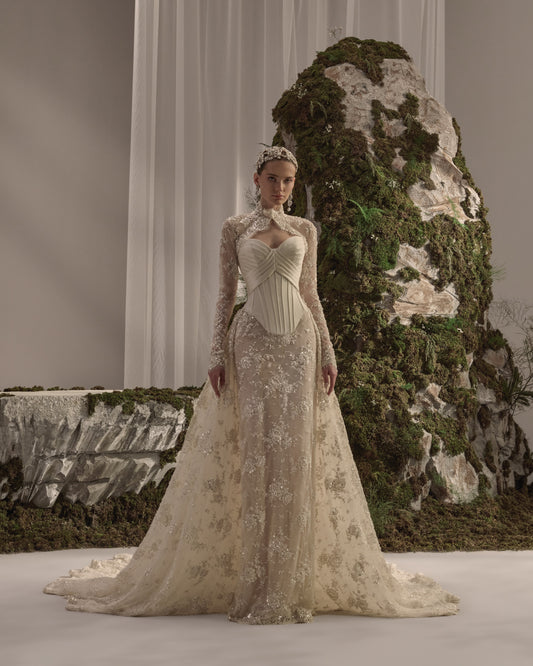 Embellished bridal gown with a structured corset bodice, flowing skirt and detachable long-sleeve embroidered bolero.