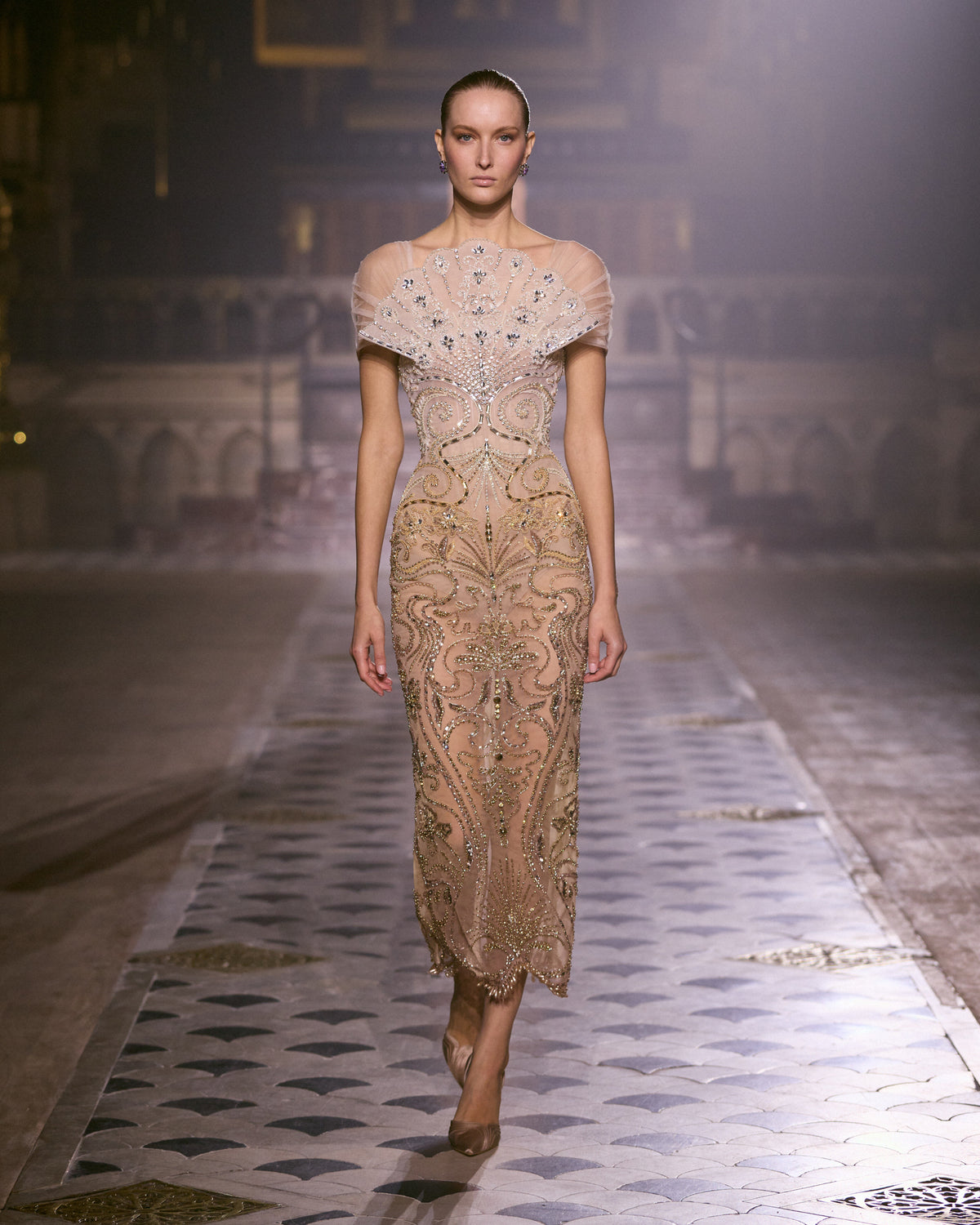 Blush pink fitted couture dress with intricate crystal embroidery and sculpted embellished neckline.