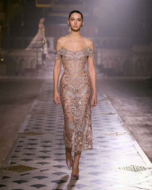 Blush pink off-shoulder couture midi dress with intricate crystal embroidery and a sculpted silhouette.