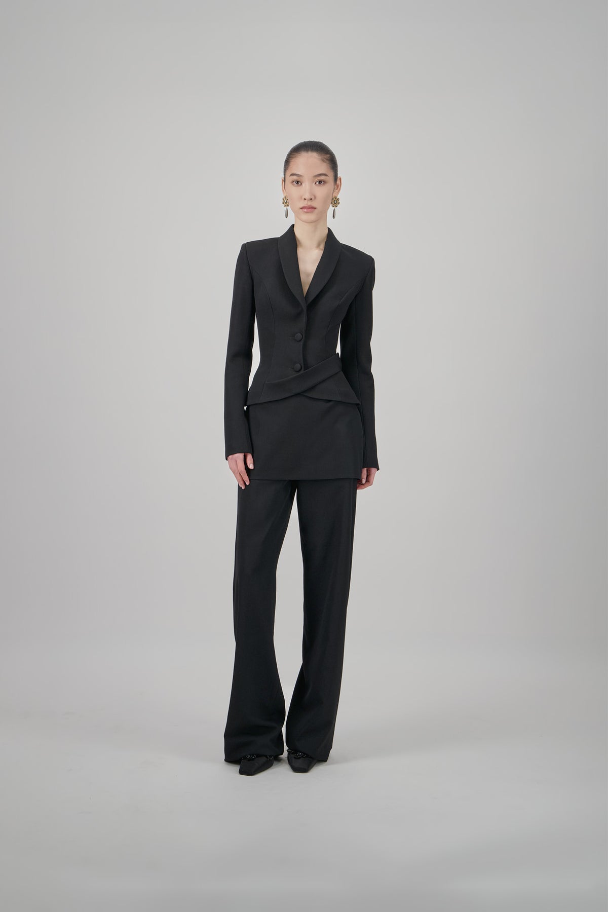 Black wool mini skirt with a clean tailored silhouette, structured finish and minimalist design.