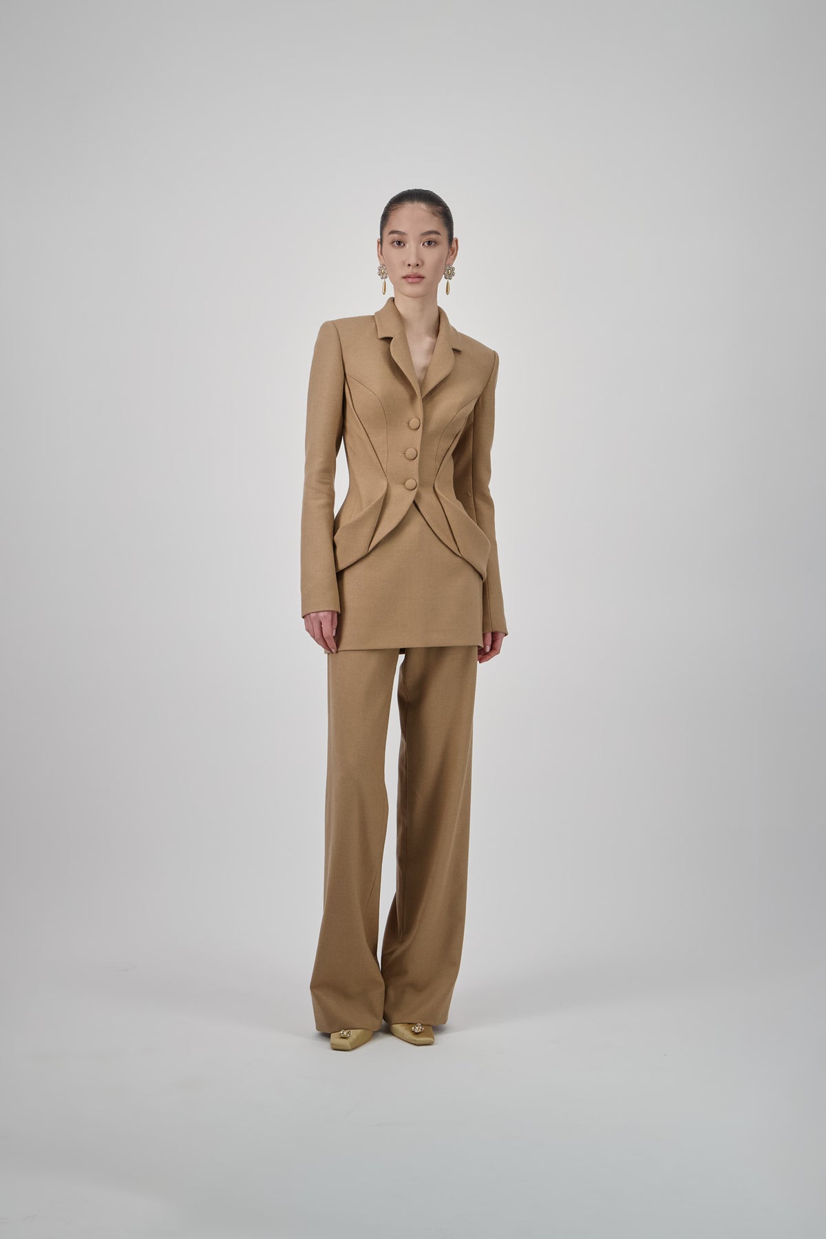 Wool mini skirt with a tailored straight silhouette, structured construction and clean finish.