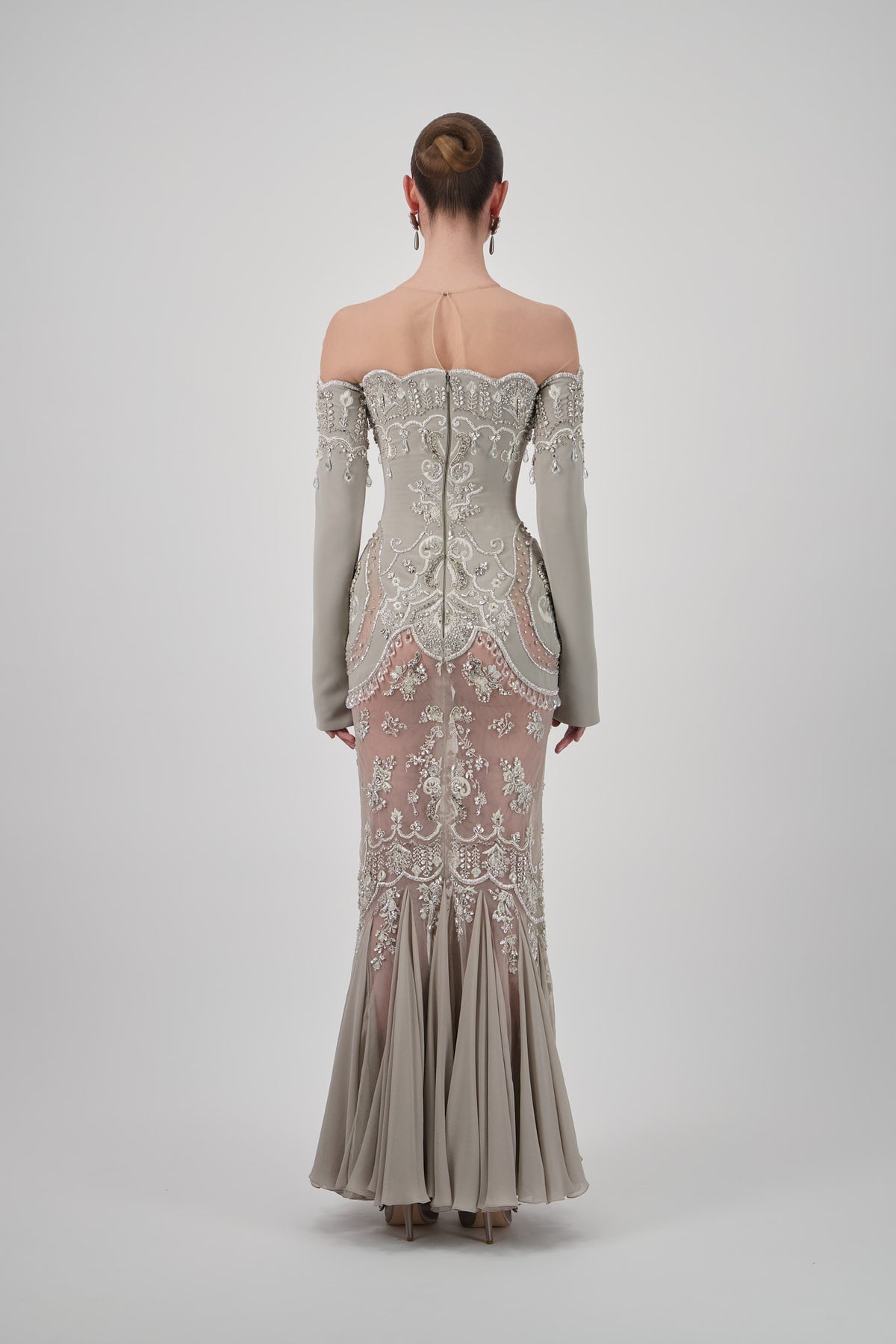 Taupe off-shoulder crepe midi dress with long sleeves, intricate crystal embroidery, sheer panels and a flared hem.