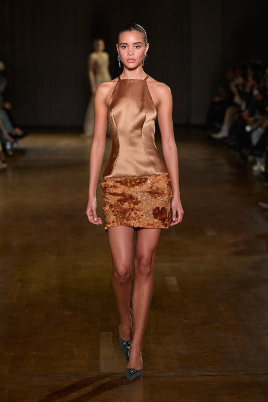 Bronze satin mini dress with a sculpted halter bodice and tonal sequin-embellished skirt.