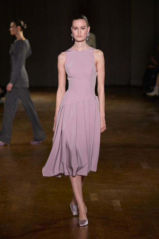 Lilac sleeveless midi dress with a fitted sculpted bodice and softly draped pleated skirt.