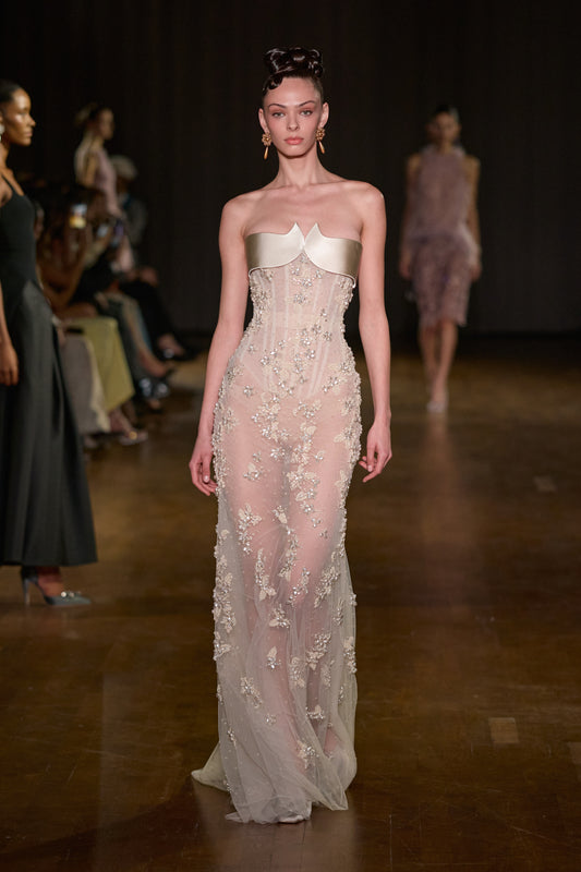 Ivory maxi dress with a sculpted satin bust, sheer corset bodice and delicate crystal floral embellishments.
