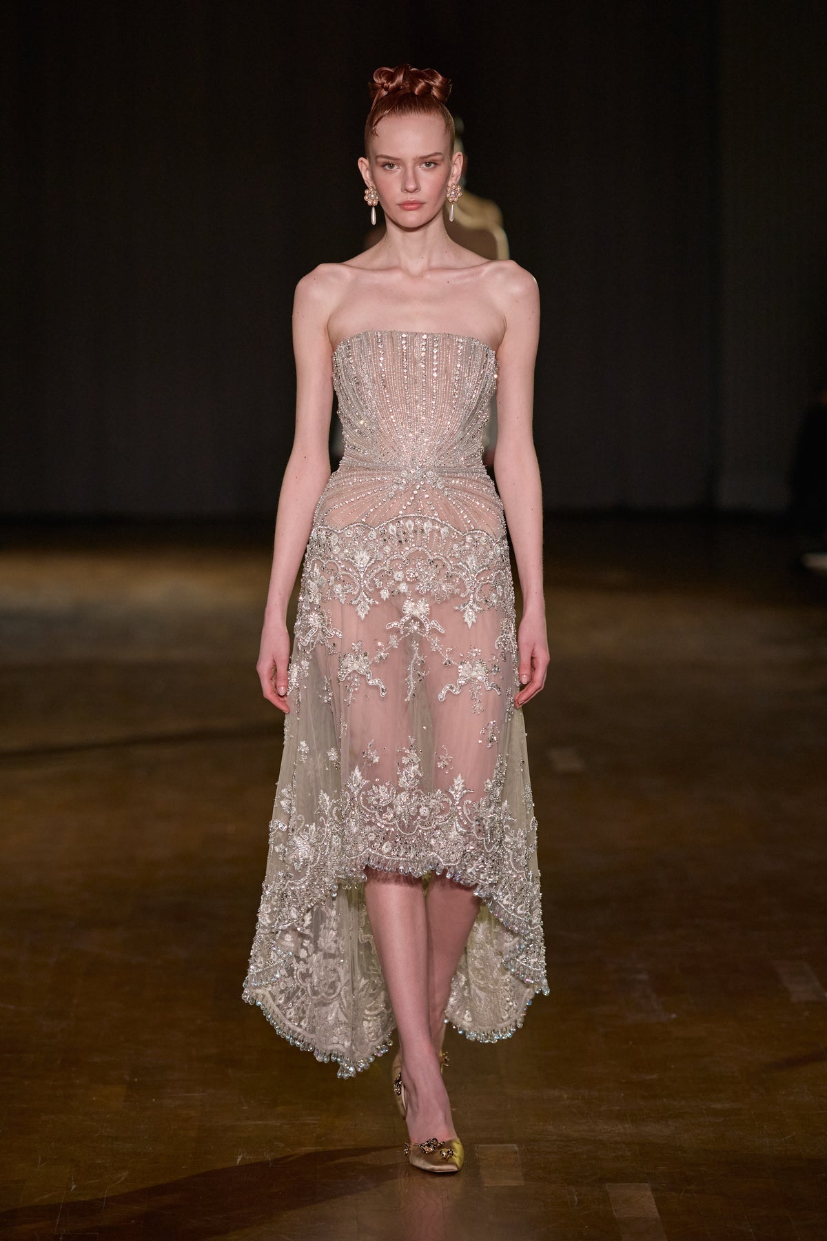 Strapless crystal-embellished dress with a fitted bodice and embroidered high-low skirt.