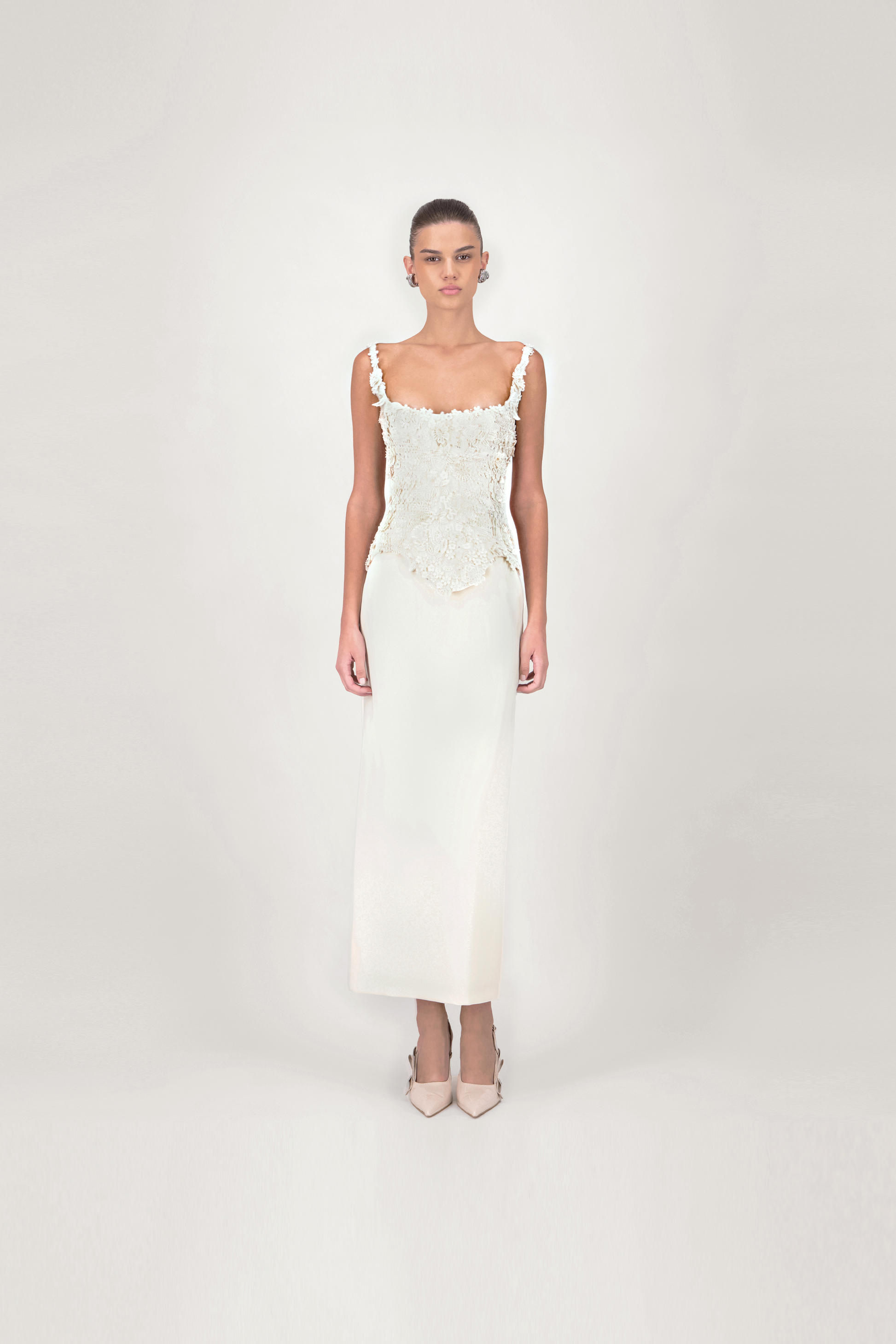 Woman wearing a white lace dress 